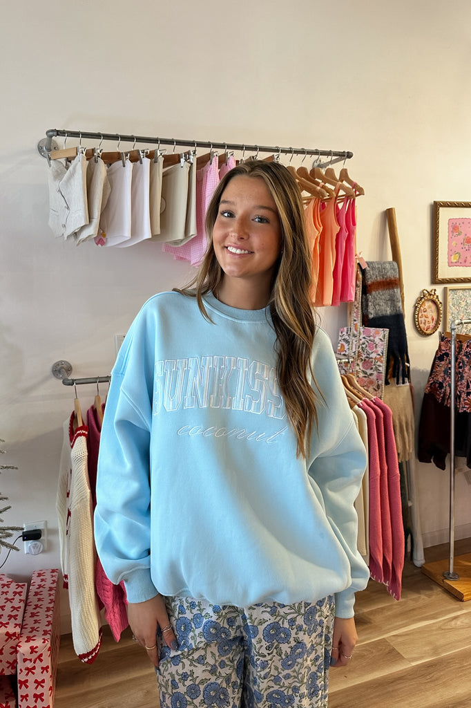 Blue Sunkissed coconut sweatshirt, Pixelated Boutique, Women's Clothing, Women's Jewelry and Gifts, Online Shopping for Women, Latest Fashion Trends 2024, Virginia Beach Clothing Stores, Homecoming Dresses, Fall/Winter 2024, Clothing Stores in Virginia Beach, Aesthetic Fashion Trends, East Coast Fashion Styles, Fall 2024 Fashion Trends, Holiday Styles, Sustainable Women's Clothing, Cozy styles, Unique Gift Ideas for Women