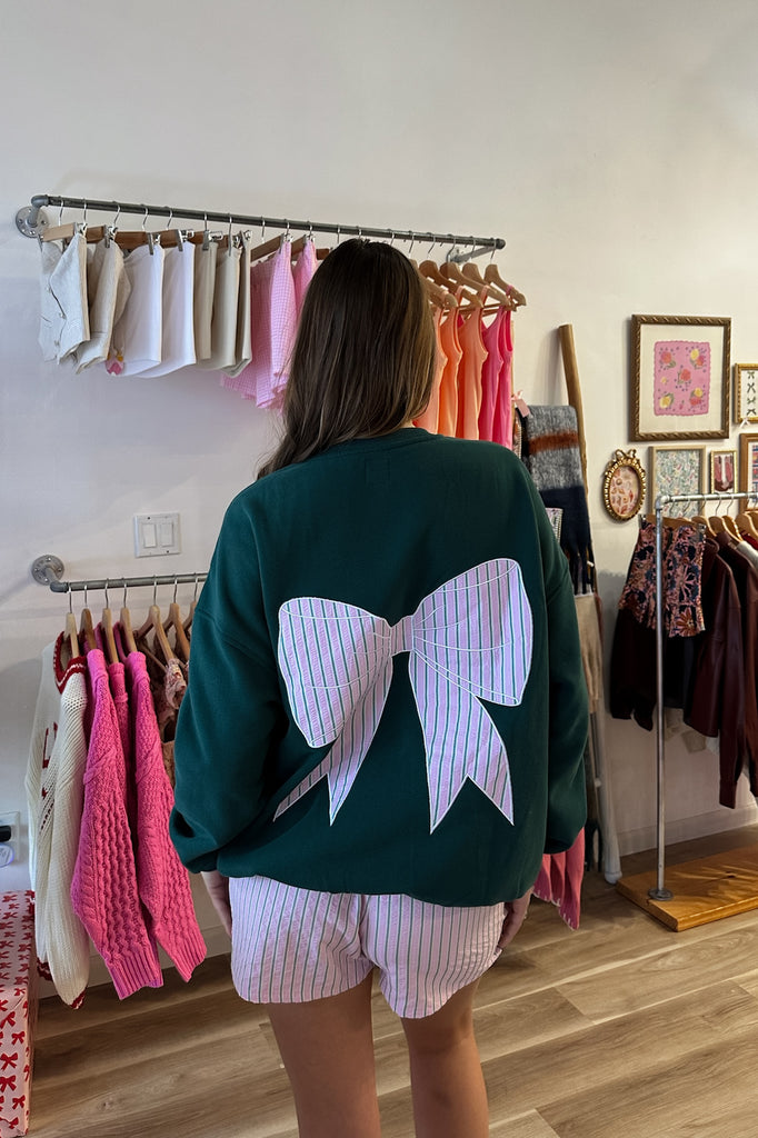 Green bow sweatshirt, Pixelated Boutique, Women's Clothing, Women's Jewelry and Gifts, Online Shopping for Women, Latest Fashion Trends 2024, Virginia Beach Clothing Stores, Homecoming Dresses, Fall/Winter 2024, Clothing Stores in Virginia Beach, Aesthetic Fashion Trends, East Coast Fashion Styles, Fall 2024 Fashion Trends, Holiday Styles, Sustainable Women's Clothing, Cozy styles, Unique Gift Ideas for Women